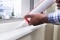 Preparing window insulation for winter with silicone